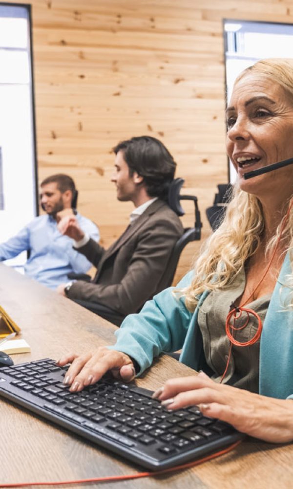 happy-mature-businesswoman-talking-as-she-wears-he-2024-10-21-22-50-53-utc